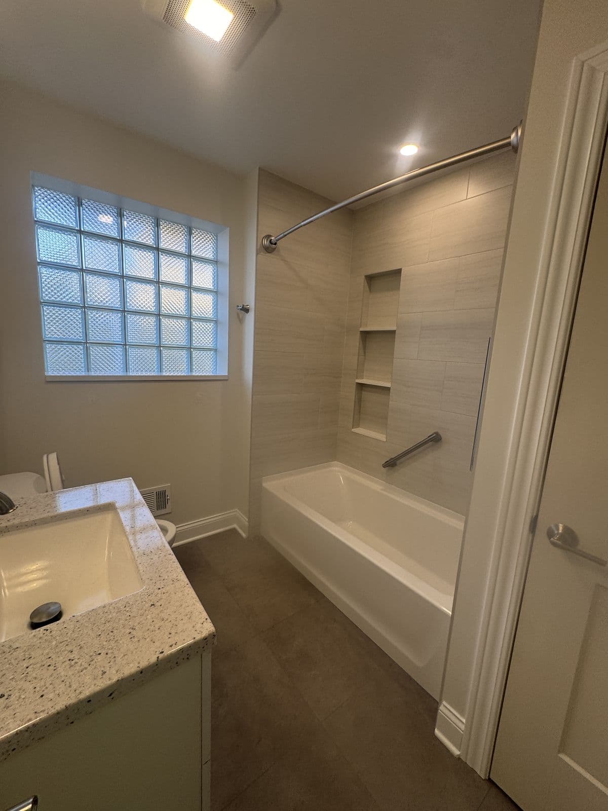 Gut-renovated bathroom with porcelain tile