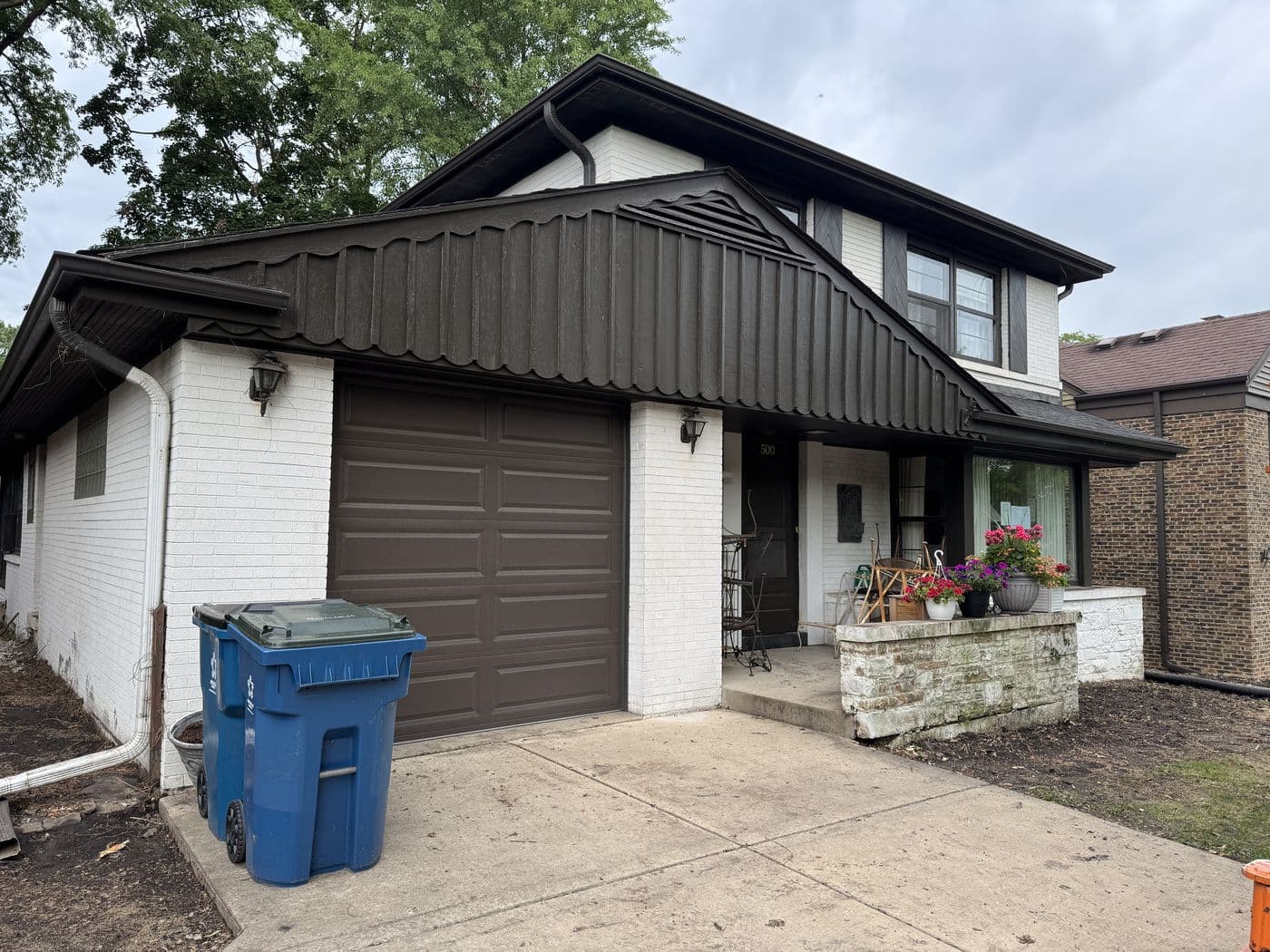 Two-story home before its whole-home design-build renovation