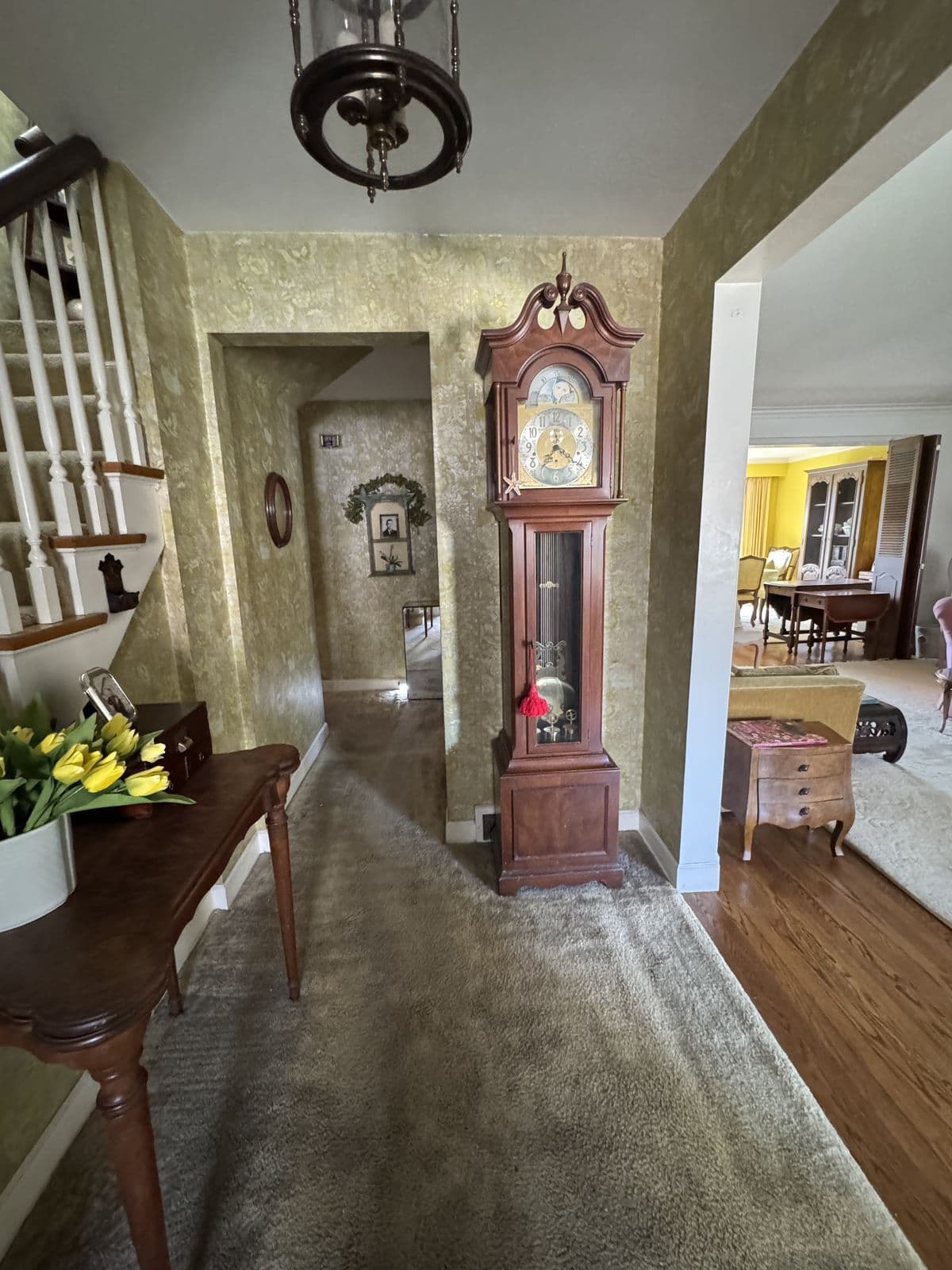 Stair hall before and after the renovation — before